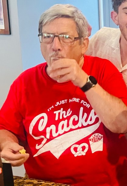 Barry, 2025 champion, wearing his I'm Just Here for the Snacks shirt