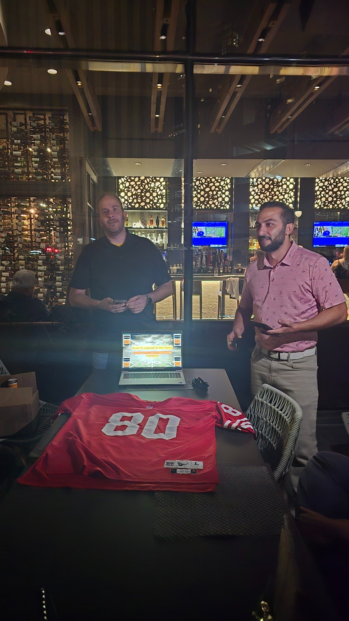 Football pool presentation with a jersey and laptop